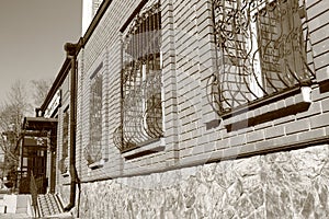 Wall of the brick house with windows