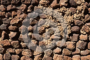 wall of brick, tuff and stone.