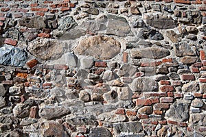 Wall of bricks and stones as a texture