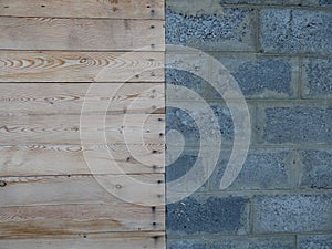 Wall of building blocks and wooden boards