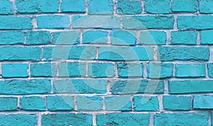 The wall of the building is made of old blue bricks. Background