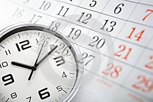 Wall calendar with the number of days and white clock face