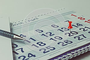 Wall calendar and pen, business concept and time