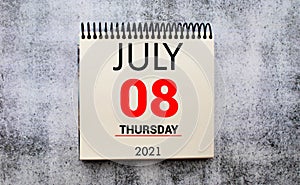 Wall calendar with a red pin - July 08