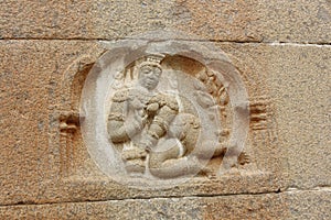 Wall carving of baby bala krishna eating butter at Gommateshwara Temple, Shravanabelagola photo