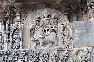 Hoysaleswara Temple wall carving of Lord Uma Maheswara lord shiva and parvati photo