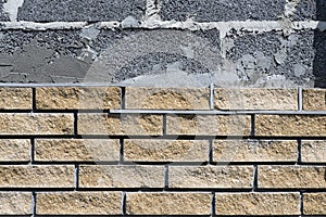 Wall cladding with decorative bricks, front view. Material for decorating the wall of house or fence