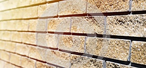 Wall cladding. Decorative bricks with rocky relief surface. Wide-angle background with copy space
