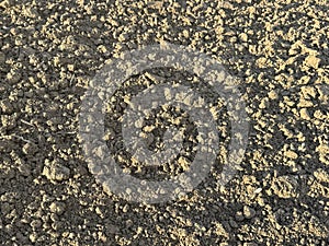 Wall of clay structure, soil background made form mud. Selective focus