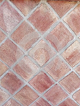 Wall formed by clay tiles photo