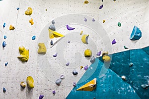 Wall with climbing holds in gym