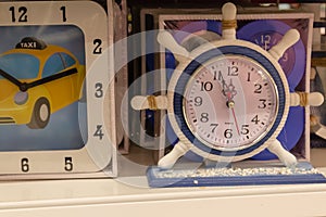 Wall clock in the form of a ship steering wheel