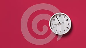 Wall clock over viva magenta background. Round white clock with black hands. Five minutes to nine. Time measuring, hour and