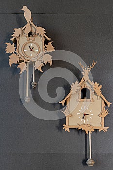 wall clock with pendulum and manual ornamentation built in cardboard