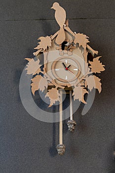 wall clock with pendulum and manual ornamentation built in cardboard