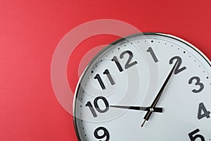 wall clock on a red