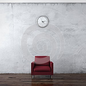 A wall clock and red chair