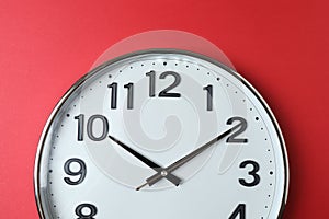 wall clock on a red