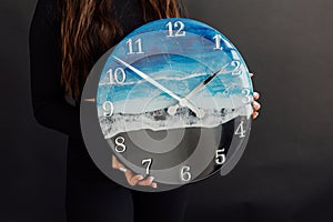Wall clock. Round clock made of epoxy resin. Sea and waves