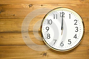 Wall clock on the wooden wall