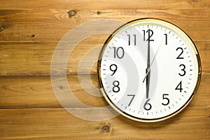 Wall clock on the wooden wall