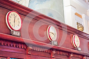 Wall clocks showing time in different capitals of the world