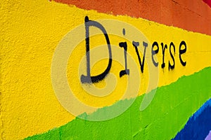 Wall with the colors of the LGBT flag and the word diverse written on it