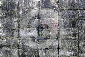 The wall of concrete tiles decorative bricks. textural composition