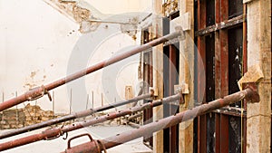 Wall of a construction site with iron props and reinforced concrete