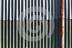 Wall of corrugated asbestos material