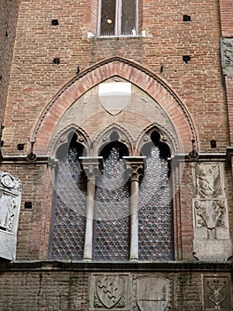 Wall of the courtyard in Palazzo Pubblico in Siena