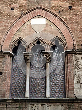 Wall of the courtyard in Palazzo Pubblico in  Siena