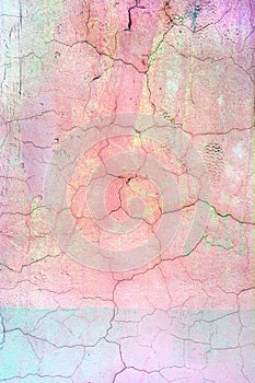 Wall with cracked bright pink paint. Bright background with vignette. Texture of old cover with cracks.