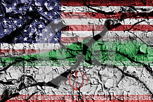 Wall cracked with the flags of the United States of America and Iran. Conceptual art