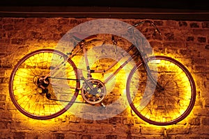 A wall decorated with a bicycle and lights