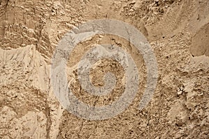 The wall of a deep sand pit with a very interesting complex structure. Background, texture