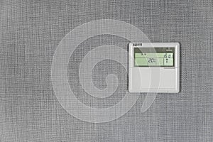 Wall display shows air temperature inside the apartment room. Smart home automation. Showing household consumptions