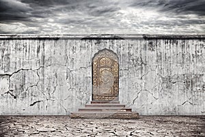 Wall with door on dry earth