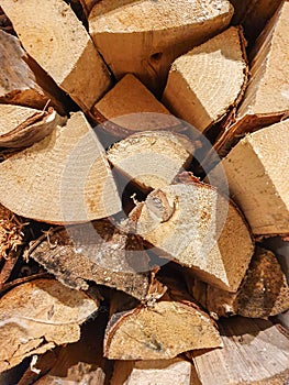 Wall firewood, Background of dry chopped firewood logs in a pile