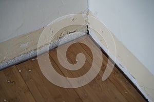 Wall and floor with no trim attached to wall