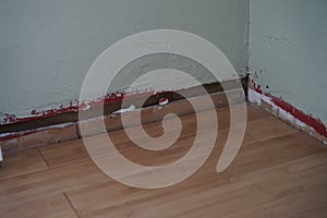 Wall and floor with no trim attached to wall
