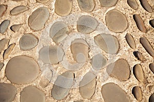 Wall or floor round stone rock texture and seamless background