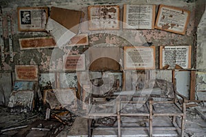 Wall with framed texts at the abandoned building at the ghost town Pripyat