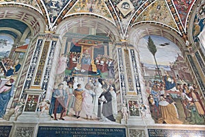 Wall frescoes in biblioteca Piccolomini of Siena Cathedral. Duomo, Siena, Tuscany, Italy.