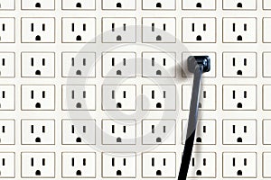 Wall full of sockets and plug