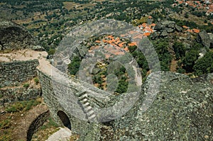 Wall with gateway in a castle on rocky hilltop at Monsanto