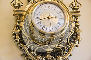 Wall goldish clock.