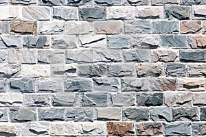 Wall of granite bricks as background