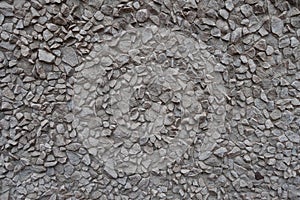 Wall with gray gravel pebble dash front view