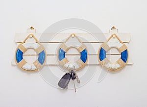 Wall hanger with remote car key on white background